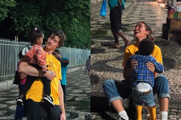 Bruna Marquezine e Shawn Mendes distribuem quentinhas em ação social